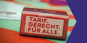 "Tarif gerecht für alle" - Schrift auf Stempel